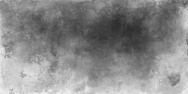 A dark and gritty vintage black and white grunge concrete wall texture with a faded grey smoke pattern creating an old textured backdrop design