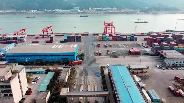 Industrial River Port with Cargo Containers and Cranes