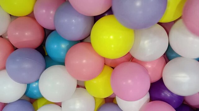 Plastic balls in a pit for play areas, ball pits, childrens entertainment, fun zone, playgrounds, sensory activities, and commercial use.