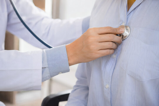 Close Up Doctor Examining Patient Chest with Stethoscope