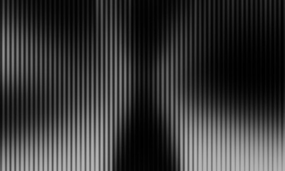 abstract black and white background with a dense arrangement of repeating vertical stripes and a slightly blurred effect (soft focus) © maskam