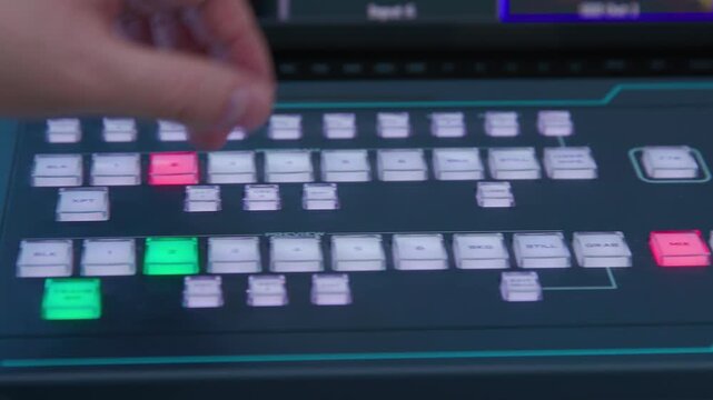 A panorama view of switching buttons on a control panel. A digital controller with a green and red buttons in the middle and zooming control arm