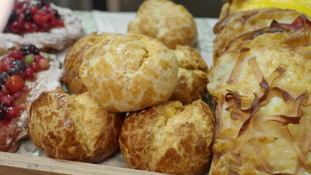 Different types of baked goods on display at a local bakery