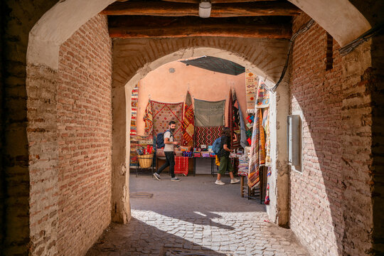 View through an arch of a Moroccan souk market in Morocco
