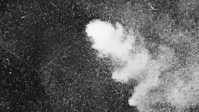 White Powder Explosion Burst with Fast Particle Cloud Trail on Black Background