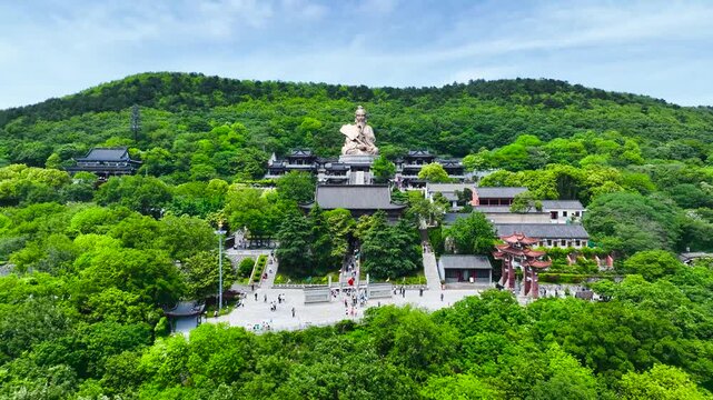 Taoist Temple with Giant Laozi Statue in Green Mountains