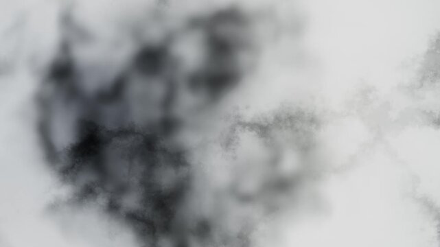 Soft smoky marble texture loop with drifting gray ink patterns