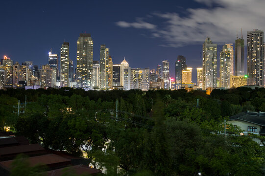 Vibrant night cityscape of Makati financial district and Ayala Center shopping hub, Makati City, Philippines