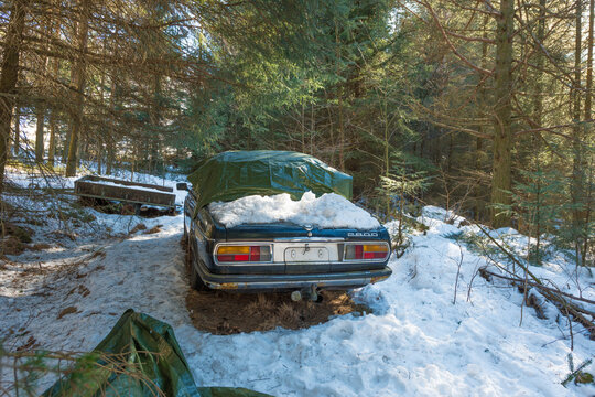 Lindesnes, Norway - March 30 2013: Abandoned BMW 2800 classic car in snowy forest storage.