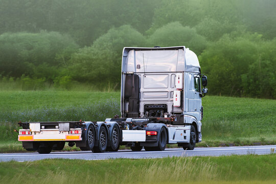 White empty tow truck on rural highway