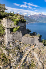 Fototapeta premium The medieval castle of Musso with Como lake and Alps mountains on background