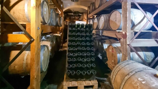 winery cellar barrels amd bottles  in zitsa village greece
