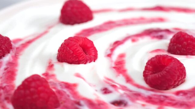 Fresh raspberry on creamy yogurt surface macro minimal composition, copy space