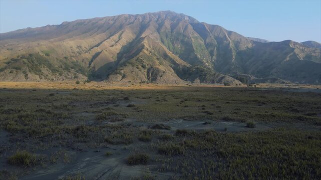 Majestic 4K view of Mount Bromo savanna hills and volcanic valley in East Java, Indonesia.