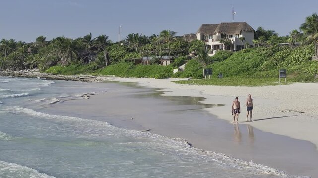 Aerial view of the turquoise sea and sandy beach at Tulum, Mexico