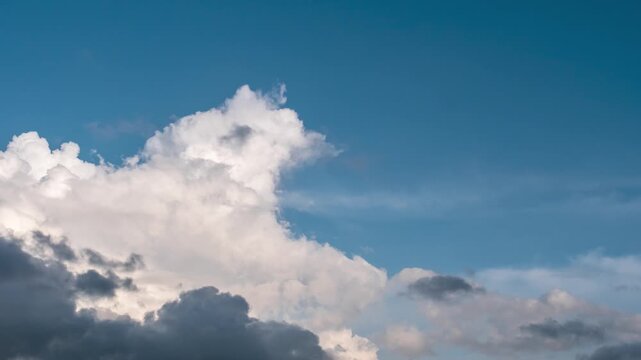 Dramatic Clouds Across Blue Sky