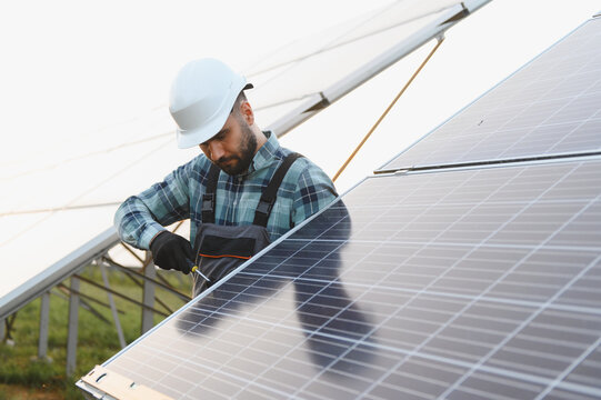 Technician working on solar panel installation