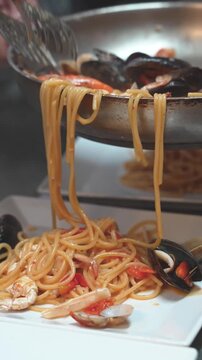 Hands preparing fresh Italian pasta dough with traditional ingredients at home kitchen