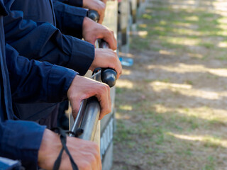 Fototapeta premium Riot police control the crowd practice and review on the grass field.