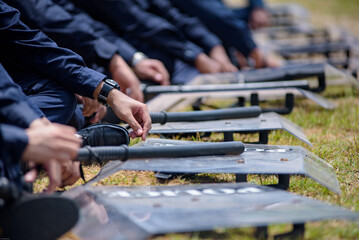 Fototapeta premium Riot police control the crowd practice and review on the grass field.