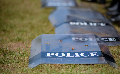Fototapeta premium Riot police control the crowd practice and review on the grass field.