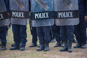 Fototapeta premium Riot police control the crowd practice and review on the grass field.