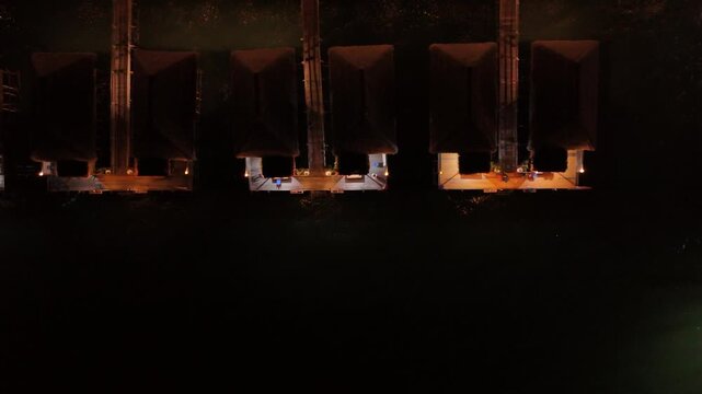 Aerial View: Floating Chalets Illuminated at Night in Batam, Indonesia - 4K
