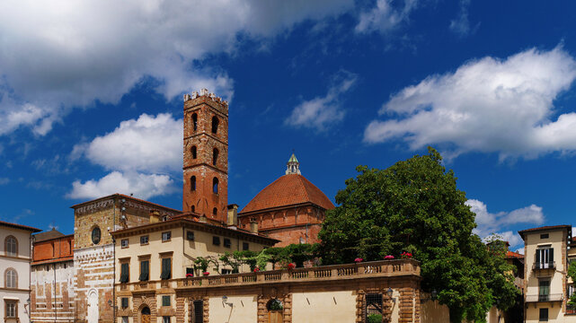Lucca beautiful historic center with St John and Reparata medieval bell tower and dome among clouds