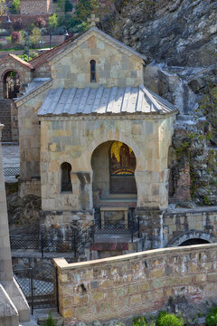 Saint Abo of Tbilisi Chapel: Ancient Stone Arch and Metal Roof