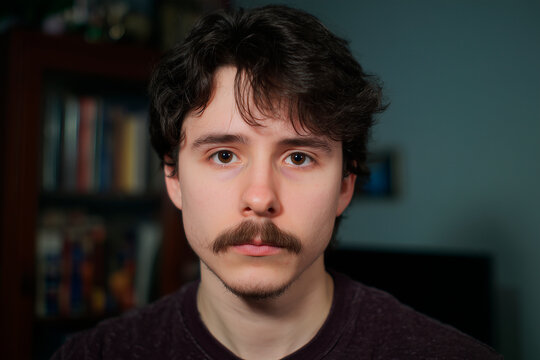 22 years old white man, dark hair, mustache, photo portrait