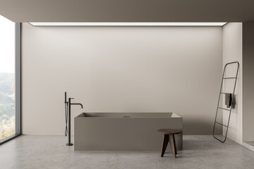 Minimalist bathroom interior with modern freestanding tub, neutral walls, soft natural light, and...