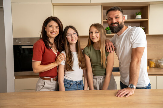 Family with daughters celebrating new home ownership concept
