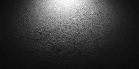 Dark textured background with a bright spotlight illuminating the upper portion, creating a dramatic and mysterious ambiance. © Art Lover 
