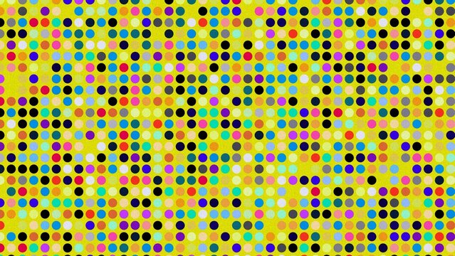 Colorful polka dot pattern on bright yellow background texture