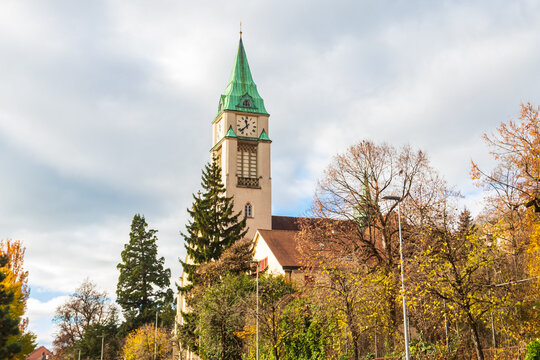 Scenic view of the historic St Maria Catholic Church (Eglise Sainte-Marie) in Biel/Bienne, Switzerland during autumn season