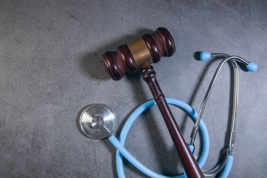 a stethoscope and a gavel on the table