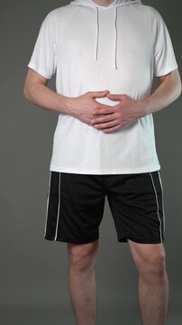 Stomach ulcer, man with abdominal pain suffering on gray background