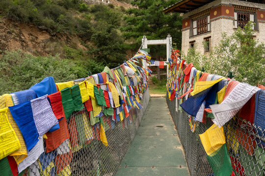 Tachog Lhakhang Bhutan, entrance walkway lined with colourful prayer flags