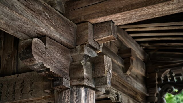 mortise. Ancient temple wooden framework detail showing mortise joints and weathered wood in natural light. real-estate listings.
