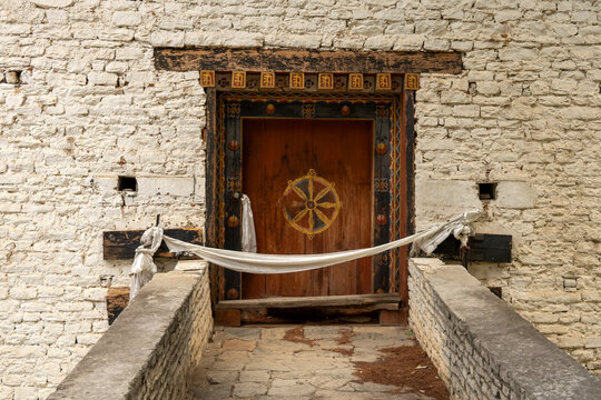 Paro Bhutan, wooden door with bhutanese decoration at Tachog Lhakhang entrance