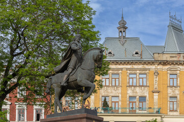 Fototapeta premium Equestrian monument to King Danylo Halytsky in Lviv Ukraine with historic architecture background
