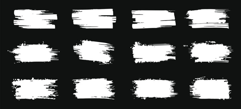 White grunge brush stroke banner collection with rough paint textures and distressed artistic brush marks on black background. Abstract ink smear frames and dry brush swatches perfect for logo 