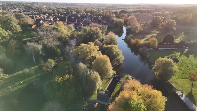 Aerial Sunset View of River Nene Winding Through Thrapston Town Northamptonshire England