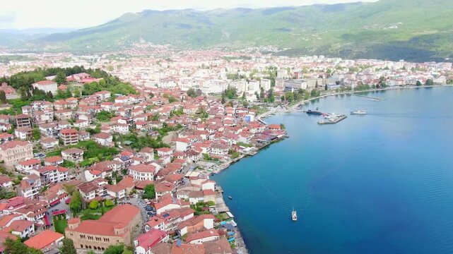 Aerial view on Ohrid lake in North Macedonia on Border with Albania. Drone Video of Coastal City and buildings near water. Top view 