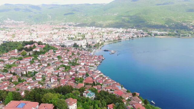 Aerial view on Ohrid lake in North Macedonia on Border with Albania. Drone Video of Coastal City and buildings near water. Top view 