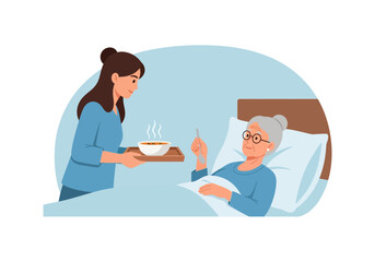 Obraz premium Young woman serving meal to elderly woman in hospital bed