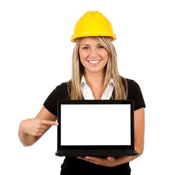 Smiling woman in hard hat holding laptop with blank screen