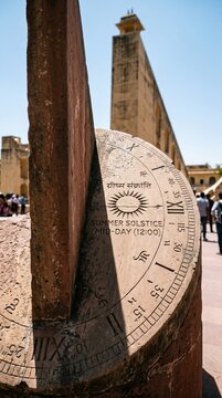 Ancient stone sundial with roman numerals inscriptions gnomon shadow historical observatory tourist heritage site