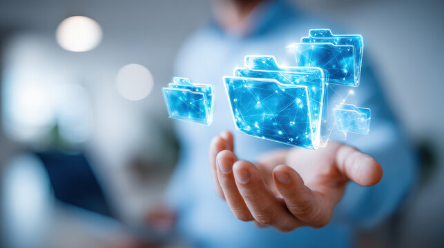 Businessman presenting holographic connected folders and digital file network above open hand for technology background and corporate banner design