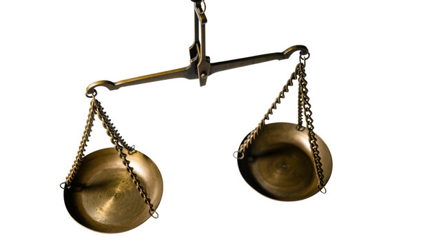 Isolated old brass balance scale for justice, equality, measurement, and legal concepts or weight